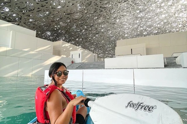 Kayaker smiling under the Louvre Abu Dhabi dome
