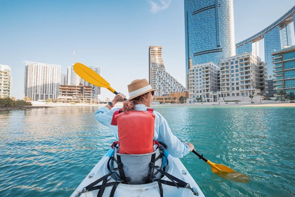 Kayaking at Reem Island Central Park with Abu Dhabi skyscrapers close behind
