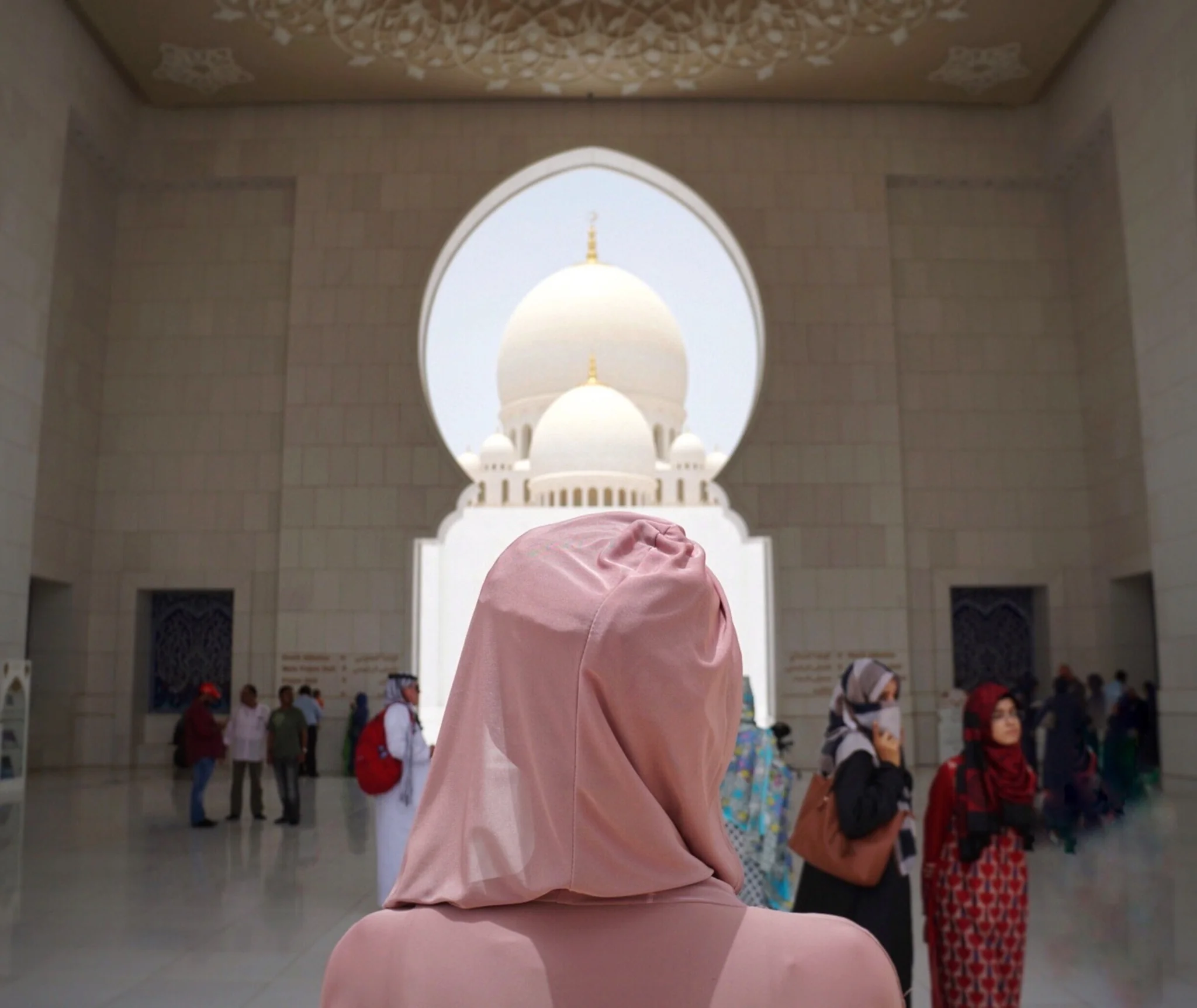 Sheikh Zayed Grand Mosque interior view framed by an archway