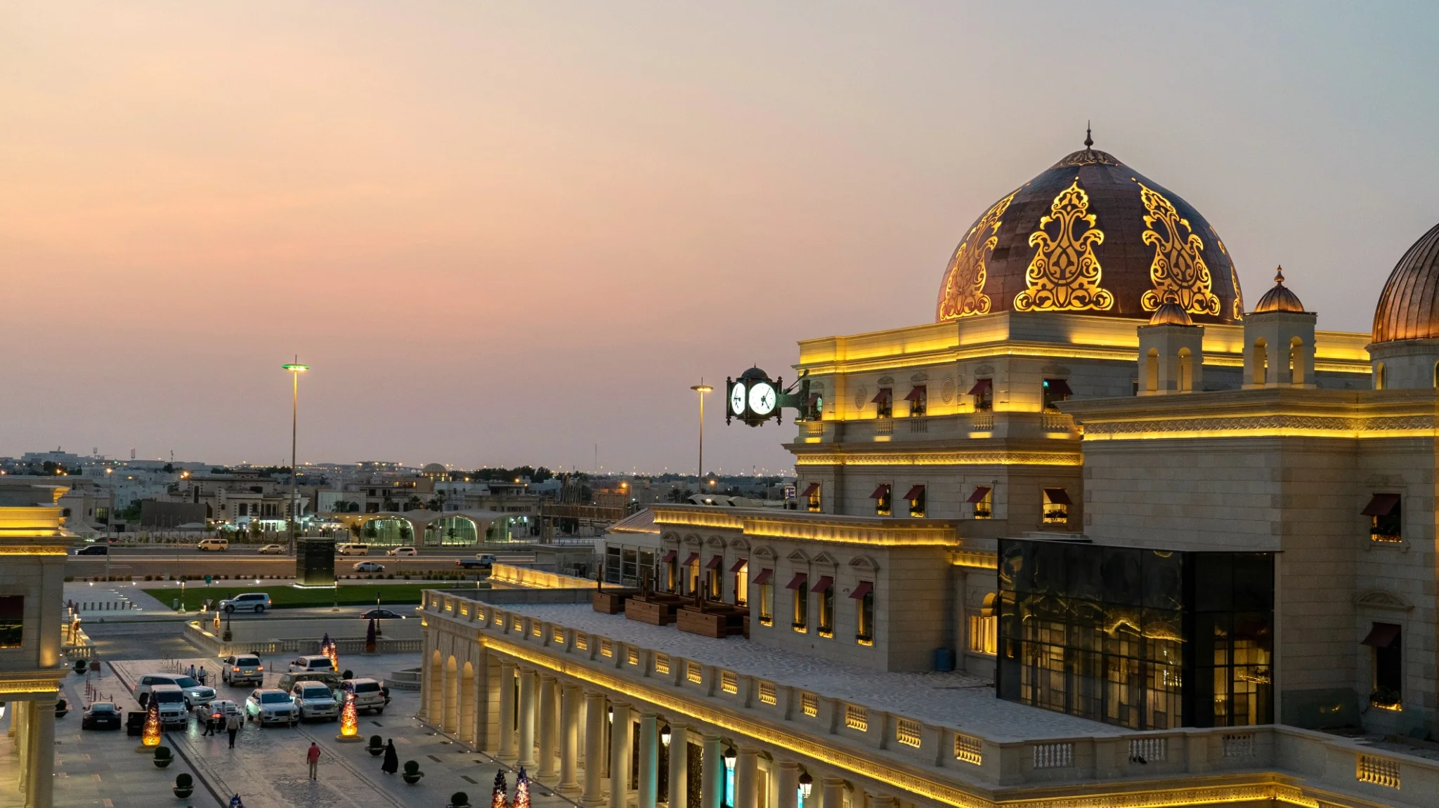 Abu Dhabi city landmark illuminated at sunset during a stopover