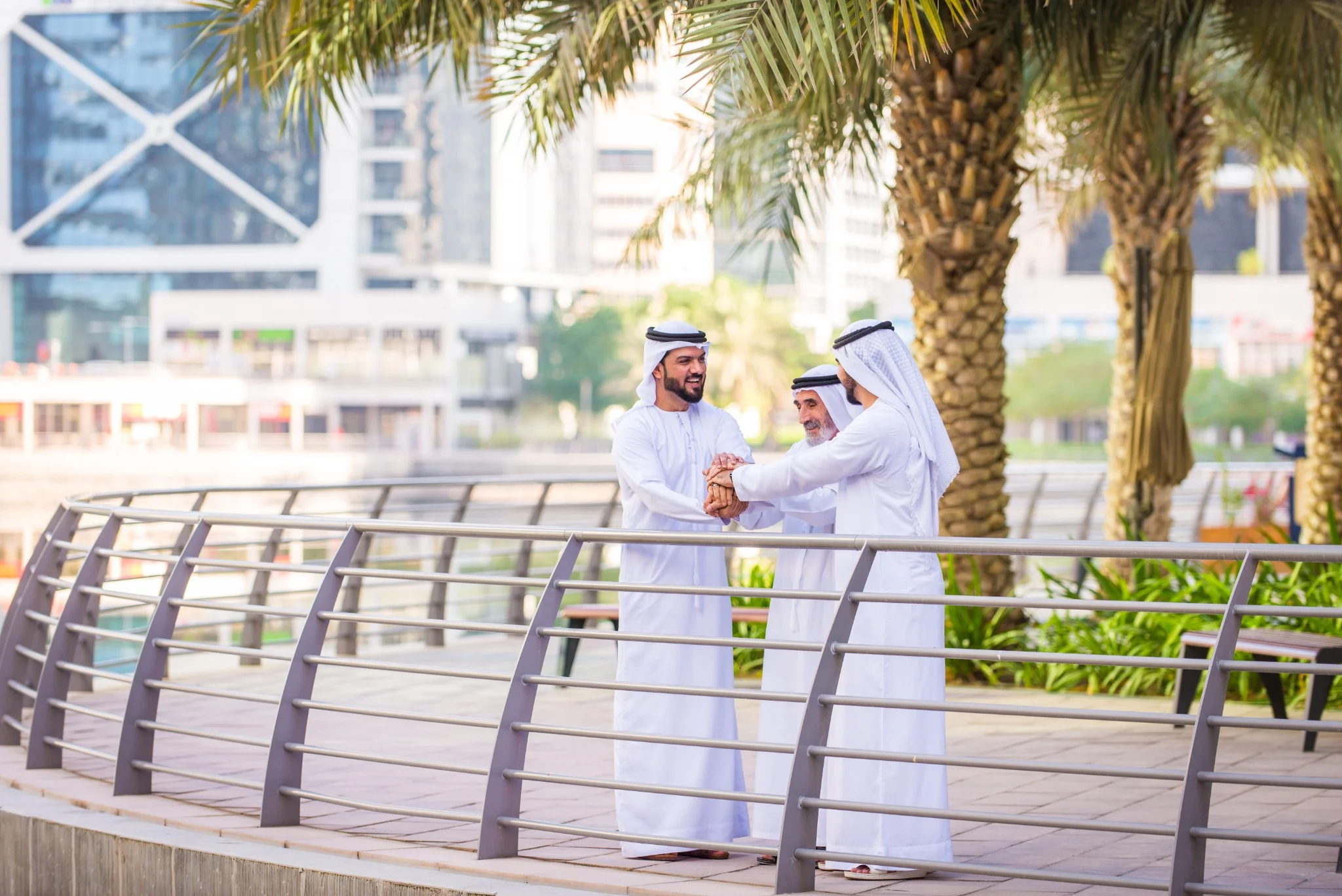 Emirati men meeting outdoors during an Abu Dhabi city visit