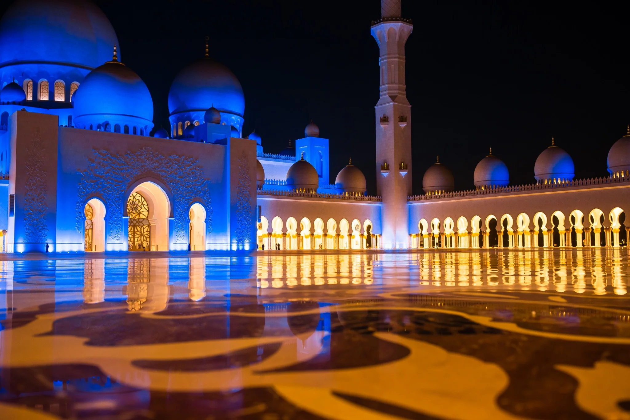 Traditional boats at Abu Dhabi harbour with the city skyline