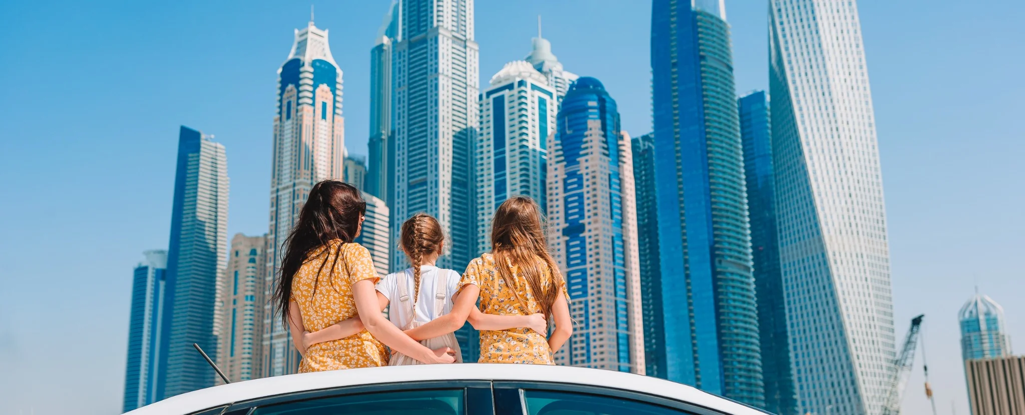 Traveller exploring a waterfront city district during a day trip from Dubai