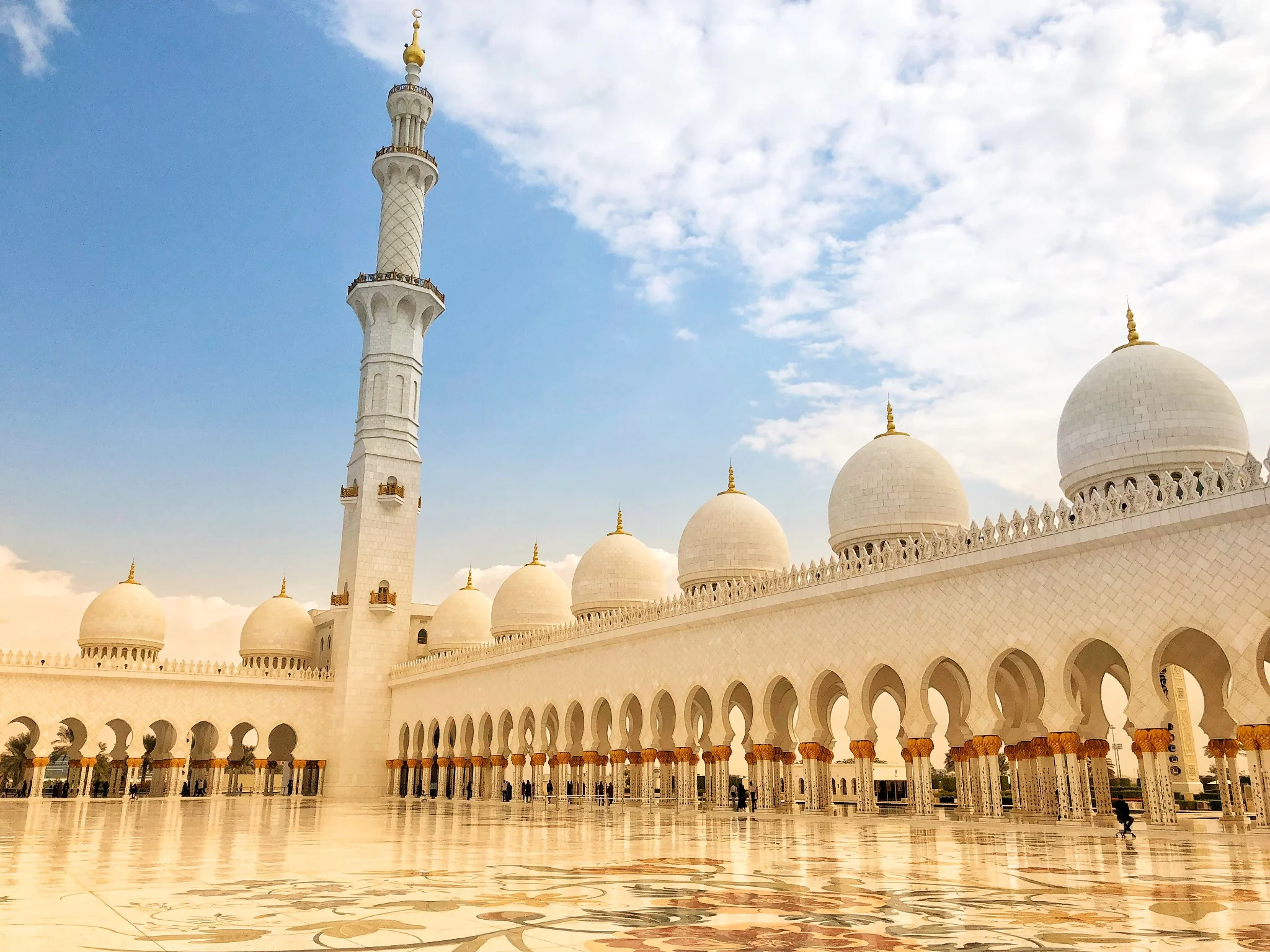 Sheikh Zayed Grand Mosque courtyard and domes during a guided visit