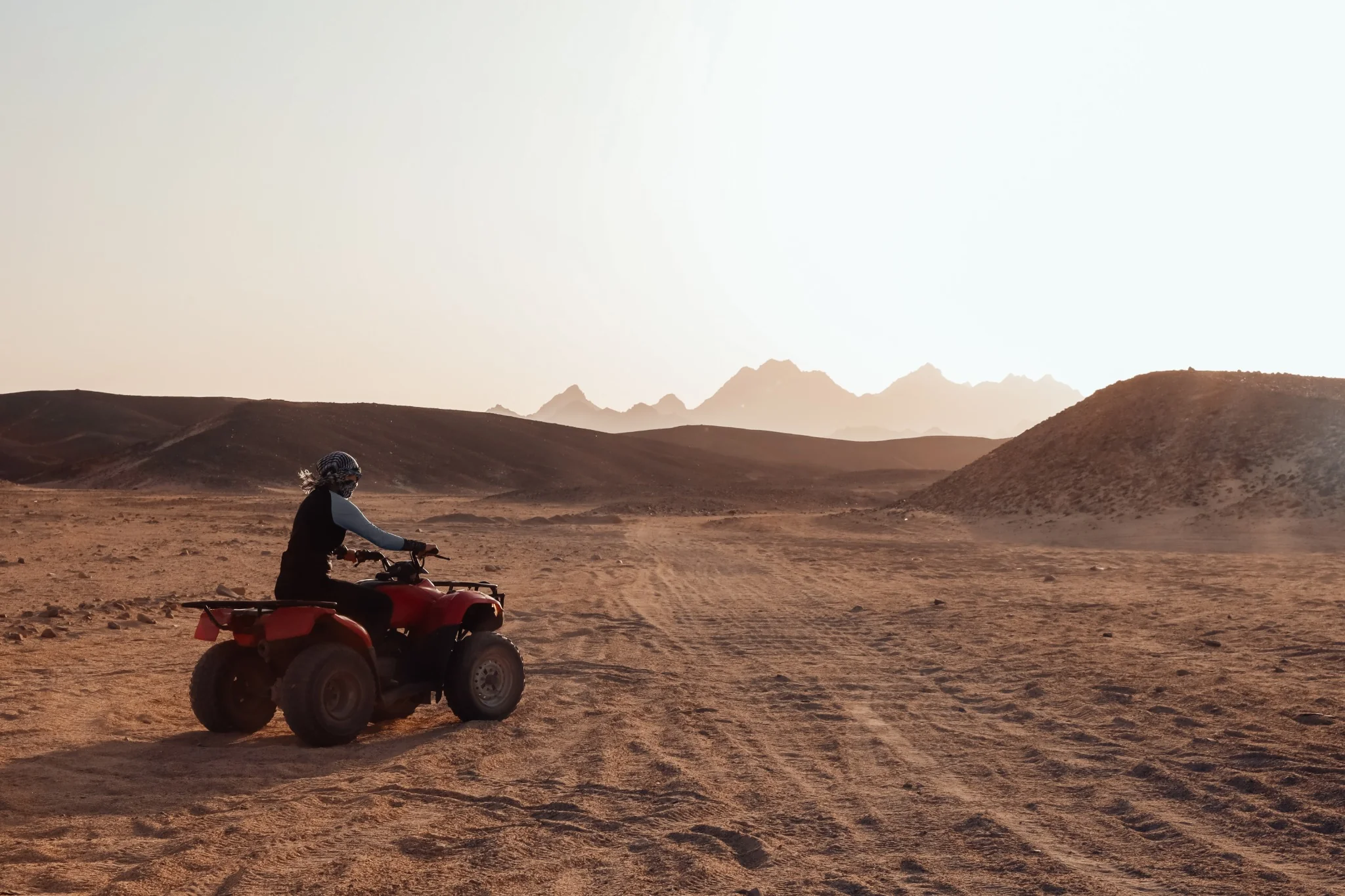 Quad bike rider exploring the Abu Dhabi desert