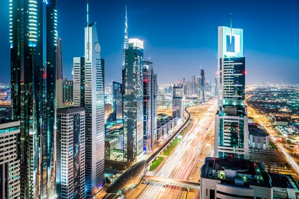 Dubai skyline and Sheikh Zayed Road illuminated at night on a full-day city sightseeing tour