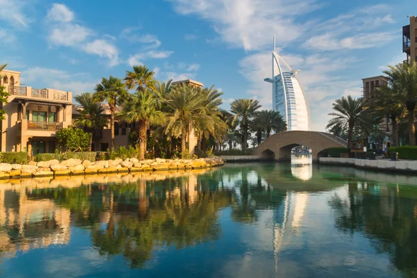 Burj Al Arab framed by waterways and palm trees during a Dubai full-day sightseeing tour
