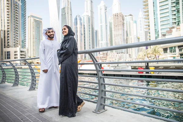 Emirati couple by Dubai Marina during a cultural city tour led by a local Emirati guide