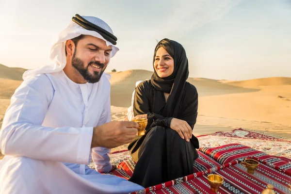 Family enjoying the dunes together on a private desert safari in Abu Dhabi