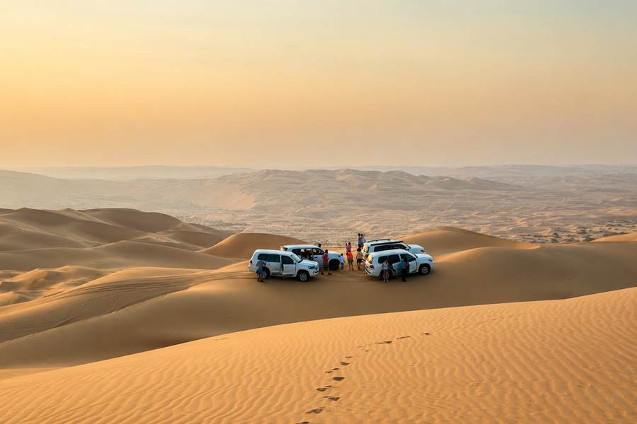 Convoy of 4x4 vehicles on the high dunes near Abu Dhabi